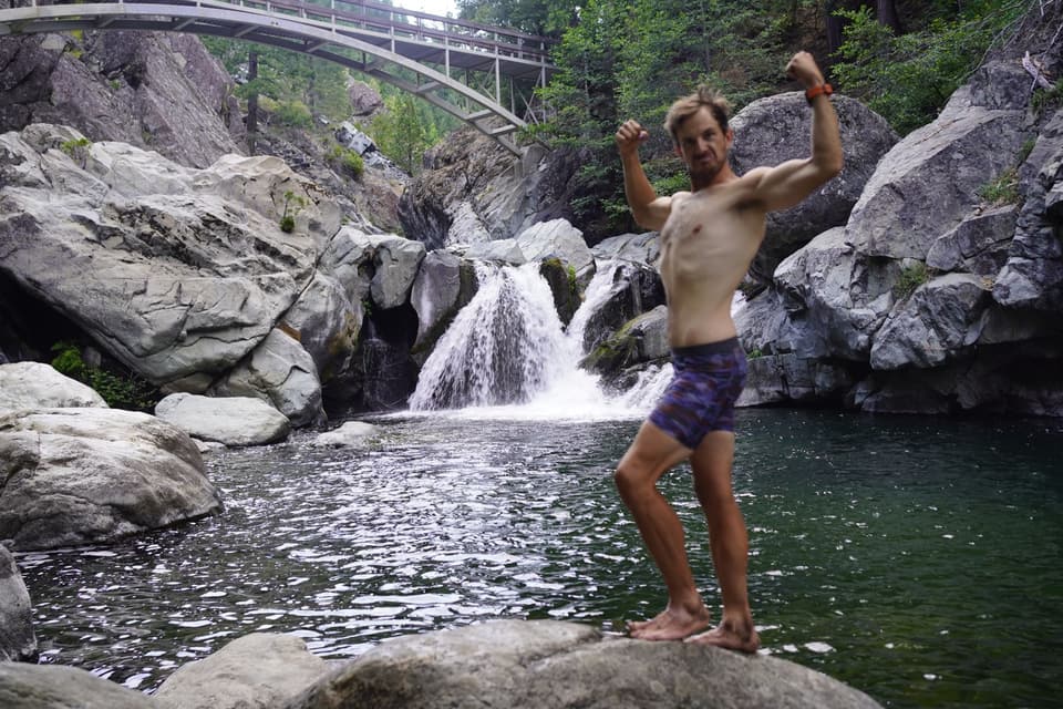 Atlas flexing on a boulder at the Yuba pool