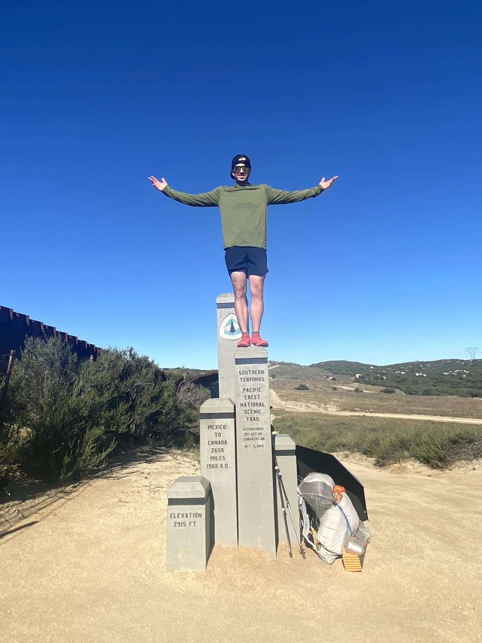 Atlas with his arms wide on top of the southern terminus monument, day 1